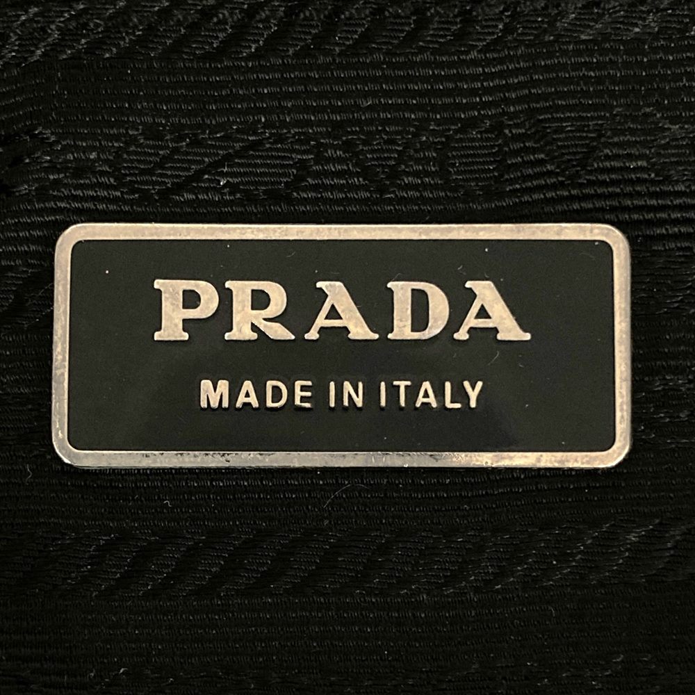 Prada handbag tote bag with triangle logo in nylon/leather, black PRE-OWNED